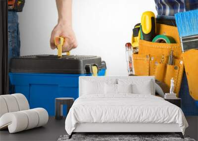 man and tool box with belt isolated on white Wall mural