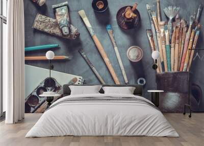 Paintbrush and tubes with painter tools at abstract table background texture. Art painter concept Wall mural