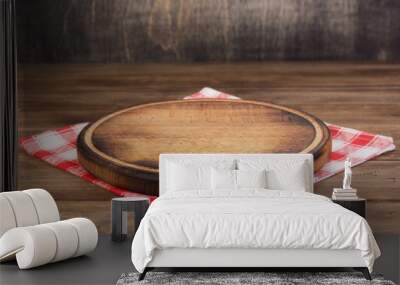 pizza cutting board at rustic wooden table in front Wall mural