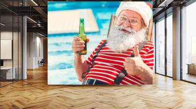 Santa Claus near the pool holiday vacation concept Wall mural