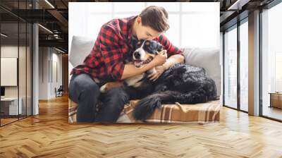 Young person with dog at home leisure Wall mural