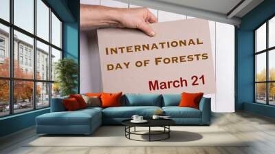 A sign celebrating the United Nations International Day of Forests at March 21.	 Wall mural