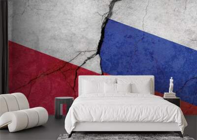 Flags of Poland and Russia, concrete wall texture with cracks, grunge background, military conflict concept Wall mural