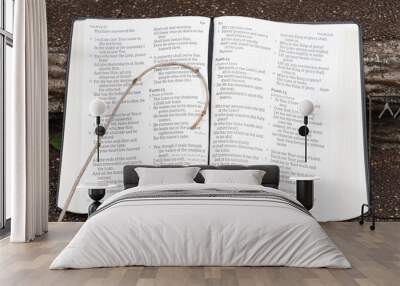 Holy Bible open with small staff on top. Highlighting Psalm 23. Outdoors on stair step. Horizontal shot. Wall mural