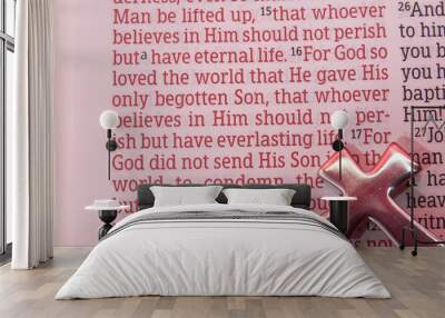 Holy Bible opened in John 3:16 with a cross reflecting the color red. Close-up. Horizontal shot. Wall mural