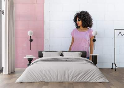 Young brunette girl of curly smiling and happy Wall mural