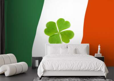 Green Clovers or Shamrocks on flag of Ireland Background for St. Patrick's Day Holiday Wall mural