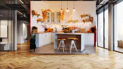 Autumn kitchen interior. Red and yellow leaves and flowers in the vase and pumpkin on light background Wall mural