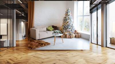 Interior of bright modern living room with comfortable sofa decorated with Christmas tree and gifts Wall mural