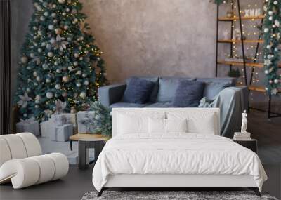 Interior of modern living room with comfortable sofa decorated with Christmas tree and gifts Wall mural