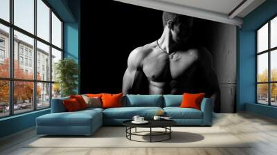 Muscular and sexy torso of young man having perfect abs, bicep and chest. Male hunk with athletic body. Fitness concept. Wall mural