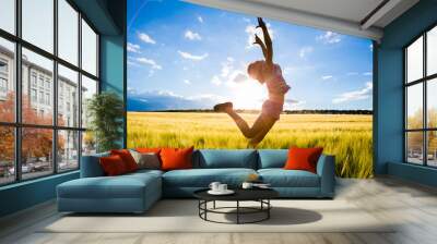 jumping kid on the field Wall mural