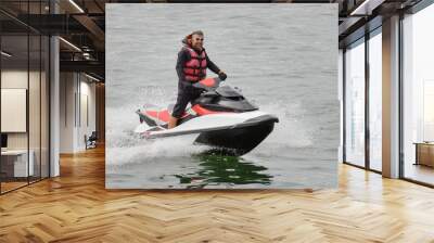 man riding a jet ski Wall mural