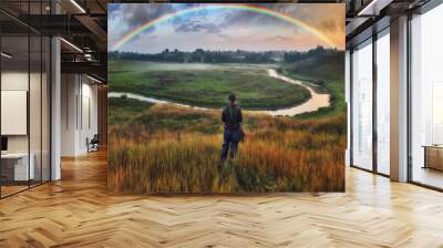 Woman Looking At Rainbow. rainbow over the autumn river Wall mural