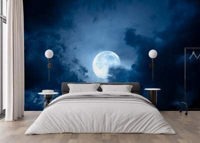 Night sky with full moon. Dramatic clouds in mystic moonlight. Large bright moon as concept of mystery, midnight, gothic time and spooky theme. Wall mural