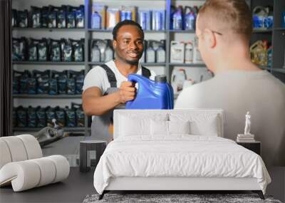 A customer speaks with a consultant at an auto parts store Wall mural