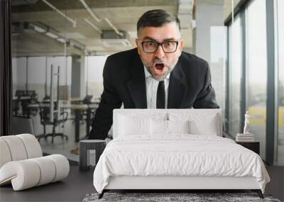 Angry businessman with document shouting at somebody Wall mural