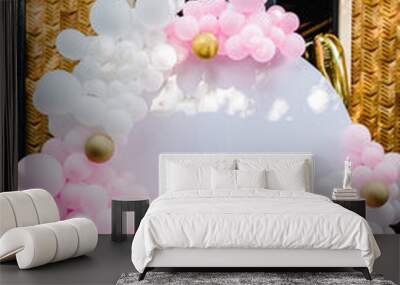 Arch decorated with pink, white and gold balloons. Trendy Cake for a girl. Copy space. Birthday Cake for 1 year on a background photo wall. Delicious reception at a birthday party. Wall mural