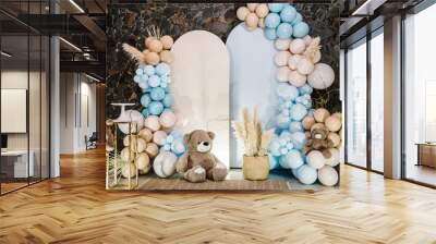 Arch with bears on background balloons. Photo-wall decoration space or place with beige, brown, blue balloons. Celebration baptism concept. Birthday party for boy. Trendy autumn decor with dry leaves. Wall mural