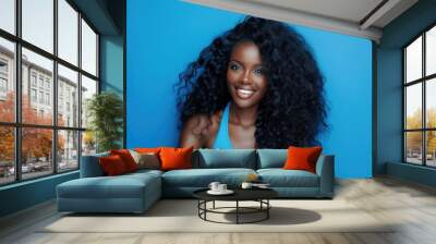 Black Woman with Beautiful Long Curly Hair Smiling in Confident Portrait Wall mural