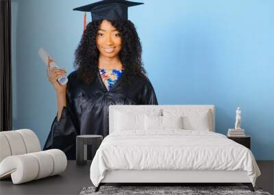 cheerful african american graduate student with diploma in her hand Wall mural