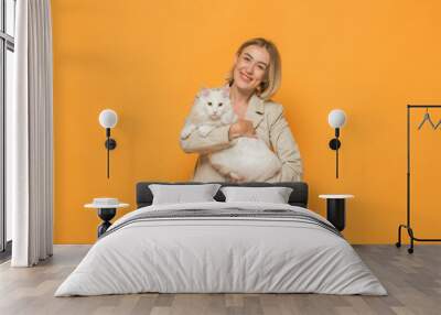 cheerful girl holding a cat isolated Wall mural