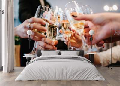 Cheers! People celebrate and raise glasses of wine for toast. Group of man and woman cheering with champagne. Wall mural