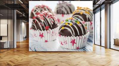 Cocoa bombs are black chocolate shells filled with cocoa powder and marshmallows Wall mural