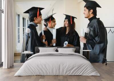 education, graduation and people concept - group of happy indian students Wall mural