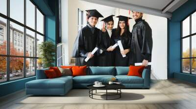 education, graduation and people concept - group of happy international students. Wall mural