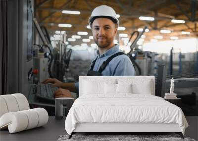 Factory worker. Man working on the production line. Wall mural