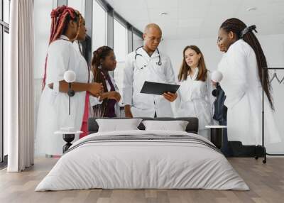 Group of doctors and nurses set in a hospital Wall mural