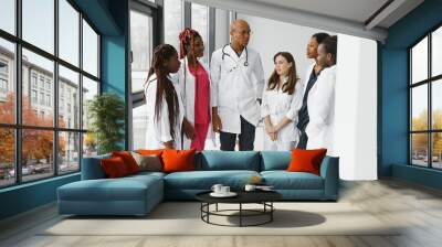 Group of doctors and nurses set in a hospital Wall mural