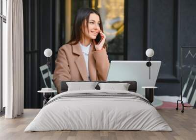 Happy Nice Woman Working on Laptop in Street Cafe Wall mural