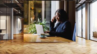 happy young african american businesswoman using computer in office Wall mural