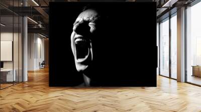 black and white photo on a black background, distorted face screaming Wall mural