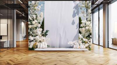 Location for luxury wedding ceremony. Arch decorated white flowers, greens, greenery, candles. Trendy decor in backyard. Photo wall with space. Celebration baptism concept. Birthday party reception. Wall mural