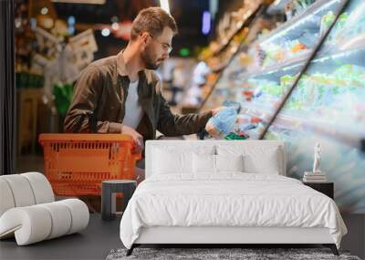 Man buying vegetables and fruit in reusable bag in grocery store, zero waste concept Wall mural