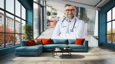 portrait of a senior doctor in his office in a hospital Wall mural