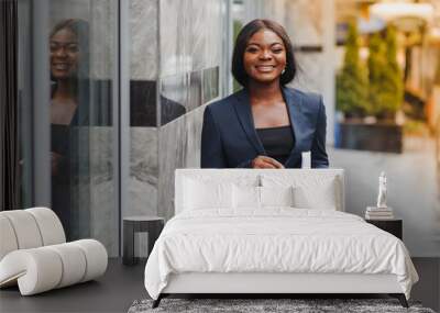 portrait of young african businesswoman standing outdoors Wall mural