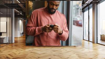 Portrait young black businessman talking on mobile phone Wall mural