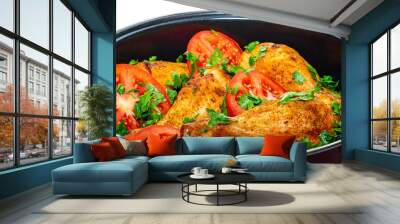 Ready-to-eat fried chicken legs with tomatoes and greens Wall mural