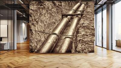 Replacement of the pipeline for the supply of hot water and heating to multi-storey buildings. There are two pipe lines in the trench. Wall mural