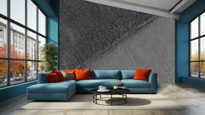 Rusted metal plates with diagonal border line divided into two parts. Black and white photo. Wall mural