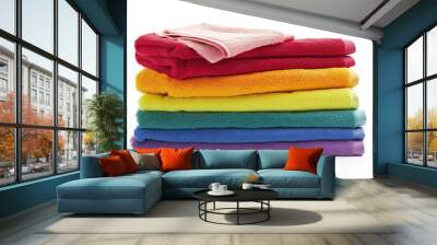 Stack of multi-colored towels on a white background, isolated Wall mural