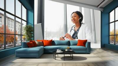 Telehealth, African American doctor in headset consulting with the patient over the phone call. Health care call center and telehealth online concept Wall mural