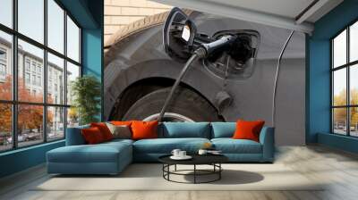 The process of charging an electric car close up Wall mural