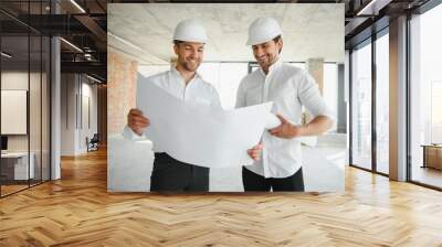 Two young man architect on a building construction site Wall mural