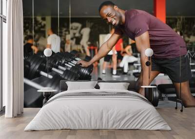 Young athletic African American man in the gym Wall mural