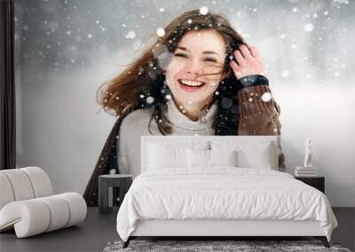 Young woman winter portrait. Close-up portrait of happy girl. Expressing positivity, true brightful emotions. Christmas girl. Expressing positivity, true brightful emotions Wall mural